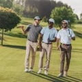 241-group+of+young+men+walking+on+golf+course+for+bachelor+party.jpg